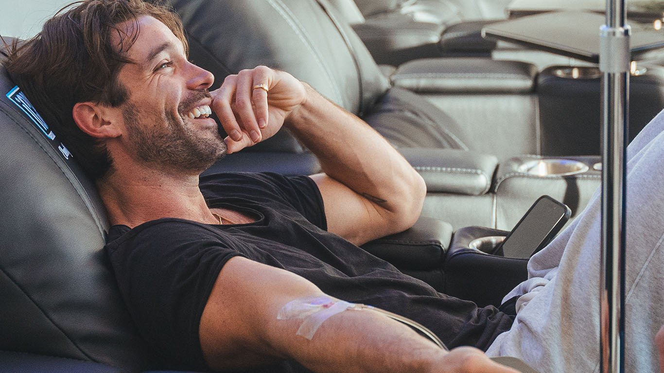 Guest relaxing during an IV drip